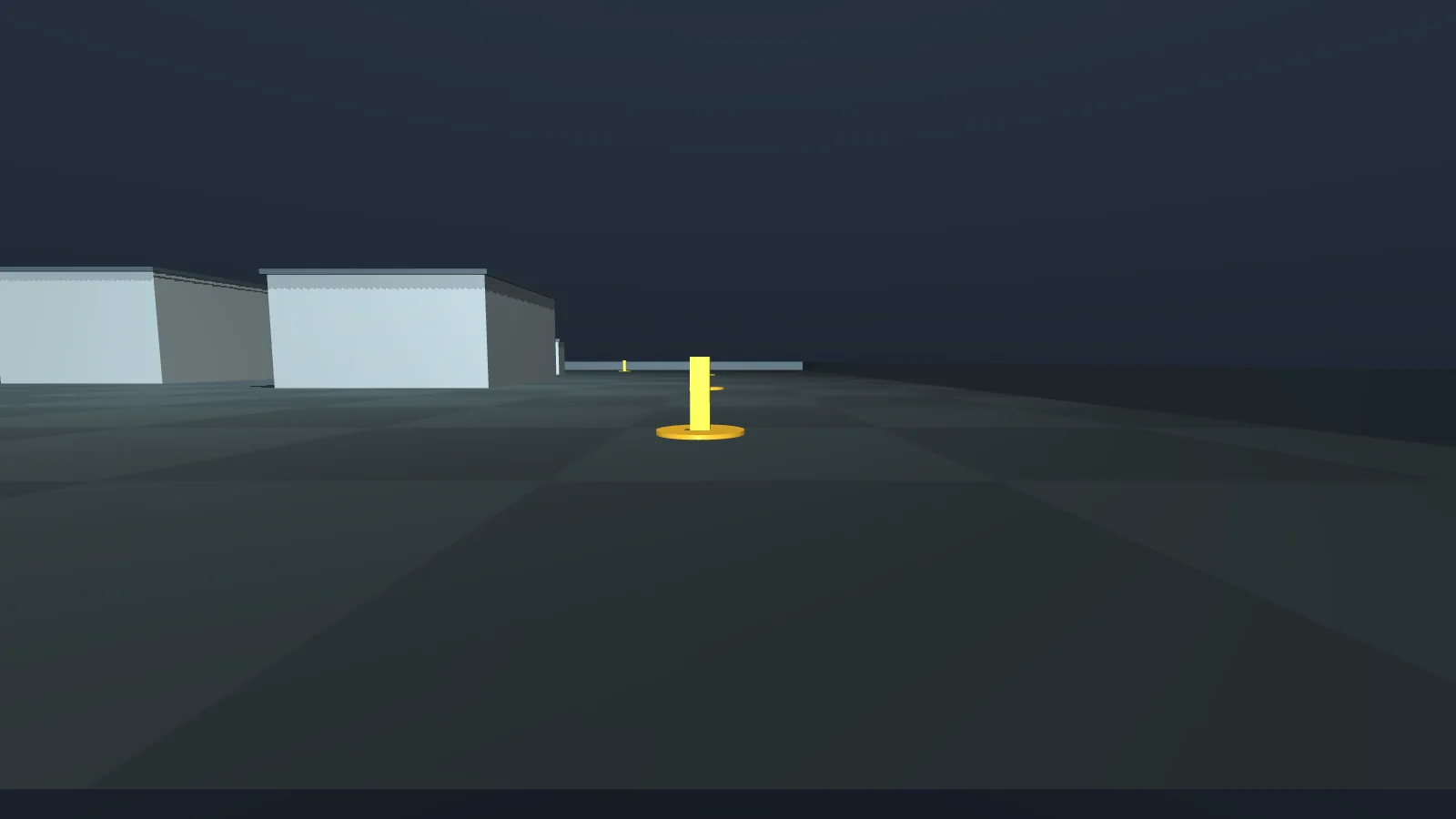 View from R0's front camera at the start, a yellow marker straight ahead and buildings to the left